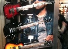 Tony MacAlpine with some tiny looking guitars