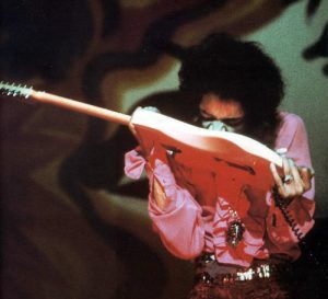 Hendrix Plays With His Teeth